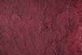 dark red colored low contrast Concrete textured background with roughness and irregularities
