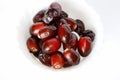 Dark Red Dates Fruit Or Date Palm In White Background. Selective Focus Royalty Free Stock Photo