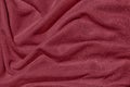 dark red draped fabric with silver lurex thread