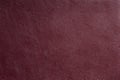 Dark-red fine texture of genuine leather. Natural expensive products Royalty Free Stock Photo