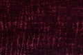 Dark red fluffy background of soft, fleecy cloth. Texture of textile closeup Royalty Free Stock Photo