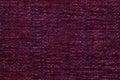 Dark red fluffy background of soft, fleecy cloth. Texture of textile closeup Royalty Free Stock Photo