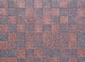 Dark red and gray stone tiles floor. Travertine, background and texture.