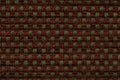 Dark red and green background from checkered pattern textile, closeup. Structure of the wicker fabric macro. Royalty Free Stock Photo