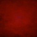 Dark red, grunge paper texture background. Darkened edges, glowing center. Royalty Free Stock Photo