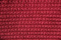 Dark red knitted fabric texture background. Top view. Copy, empty space for text Royalty Free Stock Photo