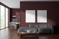 Dark red living room and kitchen interior with posters Royalty Free Stock Photo