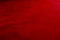 Dark red matte background of suede fabric, closeup. Velvet texture of seamless wine leather. Felt material macro Royalty Free Stock Photo