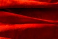 Dark red matte background of suede fabric, closeup. Velvet texture of seamless wine leather. Felt material macro. Red Royalty Free Stock Photo