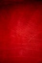 Dark red matte background of suede fabric, closeup. Velvet texture of seamless wine leather Royalty Free Stock Photo