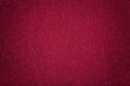 Dark red matt suede fabric closeup. Velvet texture of felt Royalty Free Stock Photo