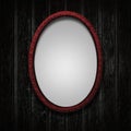 Dark red picture frame on black grunge wooden background Royalty Free Stock Photo