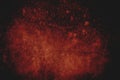 Dark red splatters on canvastexture, conceptual abstract background Royalty Free Stock Photo
