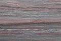 Dark red streaks in black stone