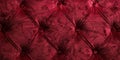 Dark red velvet fabric upholster with diamond pattern connected by buttons Royalty Free Stock Photo