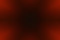 Dark red vignette background with soft glowing corners and black center Royalty Free Stock Photo