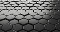 Dark, reflective hexagonal pattern creating a futuristic and geometric background texture Royalty Free Stock Photo