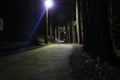 A dark road through the forest Royalty Free Stock Photo