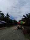 The dark road, rainbow umbrella Royalty Free Stock Photo