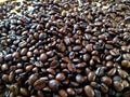 Dark roast coffee beans, background, detail top view