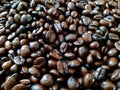 Dark roast coffee beans, background, detail top view