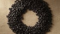 Dark roasted coffee beans arranged in a circular shape on a textured burlap background Royalty Free Stock Photo
