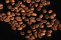 Dark roasted coffee beans arranged. Coffee beans close-up. coffee on a black background Royalty Free Stock Photo