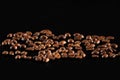 Dark roasted coffee beans arranged. Coffee beans close-up. coffee on a black background Royalty Free Stock Photo