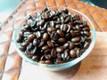 Dark roasted coffee beans cloes up