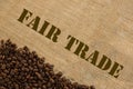 Dark roasted fair trade coffee beans with text Fair Trade Royalty Free Stock Photo