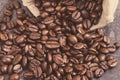 Dark roasted fragrant coffee beans in jute bag