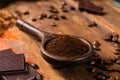 Dark roasted pure arabica coffee beans and ground coffe on the w Royalty Free Stock Photo