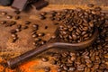 Dark roasted pure arabica coffee beans and ground coffe on the w Royalty Free Stock Photo