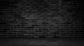 dark room with concrete floor and black brick wall background. Royalty Free Stock Photo