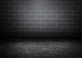 A dark room consisting of white and black concrete floors with a masonry wall gliding aside. The light shines down in the middle o Royalty Free Stock Photo