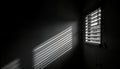 Dark room interior. Light rays create shadows on wall from louvers. Roller window shutter visible. Nightclub ambiance. Light Royalty Free Stock Photo