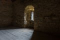 Dark room with stone walls and window Royalty Free Stock Photo