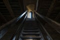 Dark room with stone walls window and wooden staircase Royalty Free Stock Photo