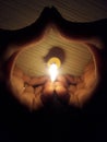 Buring candle, two hands making symbol of LOve in Dark room Royalty Free Stock Photo