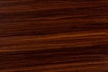 Dark rosewood background, natural wooden texture with patterns. Royalty Free Stock Photo