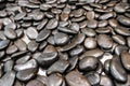 Dark round pebble stone, river rock texture background. Royalty Free Stock Photo