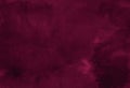 Dark saturated burgundy watercolor background with torn strokes and uneven spots. Trend color texture. Abstract background Royalty Free Stock Photo