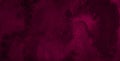 Dark saturated burgundy watercolor background with torn strokes and uneven spots. Trend color texture. Abstract background