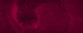 Dark saturated burgundy watercolor background with torn strokes and uneven spots. Trendy color texture. Royalty Free Stock Photo