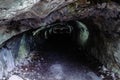 Dark and scary caves with a long tunnel Royalty Free Stock Photo