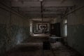 Dark, scary, collapsed, abandoned, old. creepy, room with windows covered in the building located in the Chernobyl ghost town