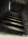 Dusty attic stairs with cobwebs