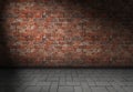 Dark scene with spotlight on red brick wall background Royalty Free Stock Photo