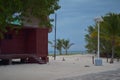 Dark scenery of a wooden house on a sandy beach on a cloudy sky background Royalty Free Stock Photo