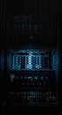 Dark server rack with glowing blue light. Modern data center storage and cloud computing infrastructure. Network security concept Royalty Free Stock Photo